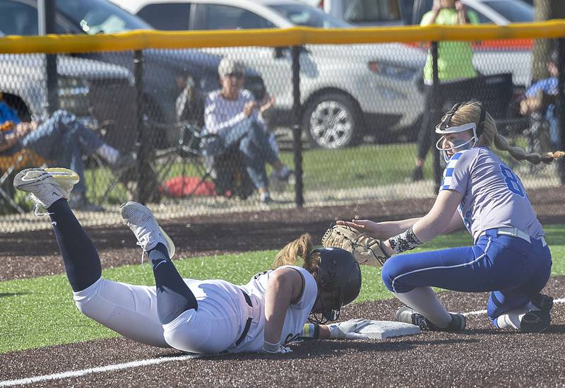 Sterling’s Carley Sullivan dives back to third safely against Newman Thursday, April 27, 2023.