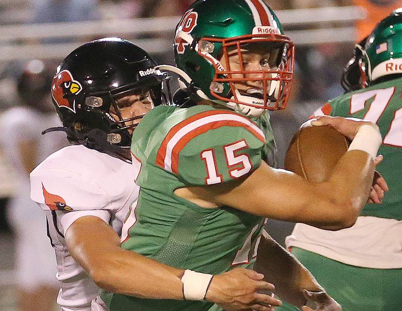 Metamora's Cam Nickel wraps up L-P's quarterback Brendan Boudreau on Friday, Sept. 1, 2023 at Howard Fellows Stadium.