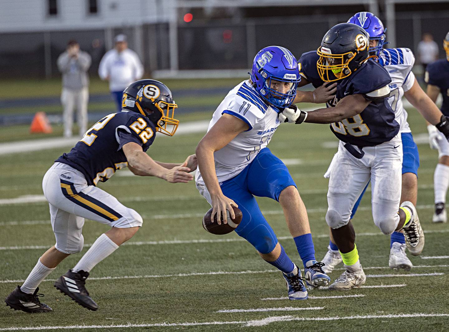 St. Francis’s Alessio Milivojevic looks to get away from Sterling’s Wyatt Cassens (left) and Kendric Muhammad Saturday, Nov. 4, 2023 in a class 5A playoff game in Sterling.