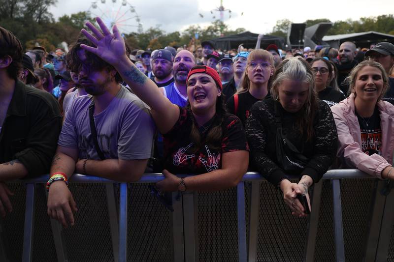 A fan sings along to the music of Something Corporate at Riot Fest on Sunday, Sept. 22, 2024 in Chicago.