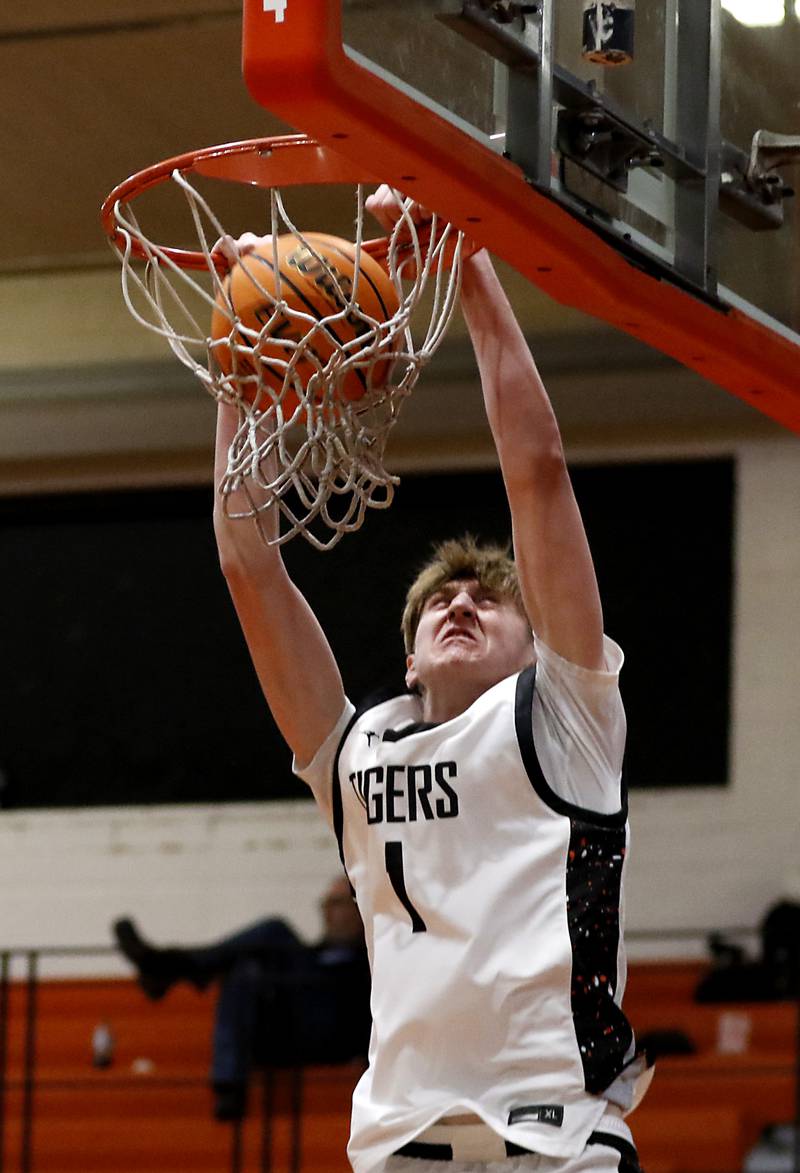 Crystal Lake Central's JJ Parrish dunks the basketball during a Fox Valley Conference basketball game against Hampshire on Friday, Feb. 7, 2025, at Crystal Lake Central High School.