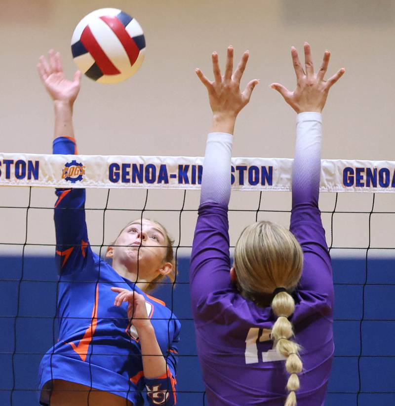 Genoa-Kingston's Presley Meyer tries to spike the ball by Rochelle's Jillian Bruns Monday, Sept. 15, 2025, at Genoa-Kingston High School.
