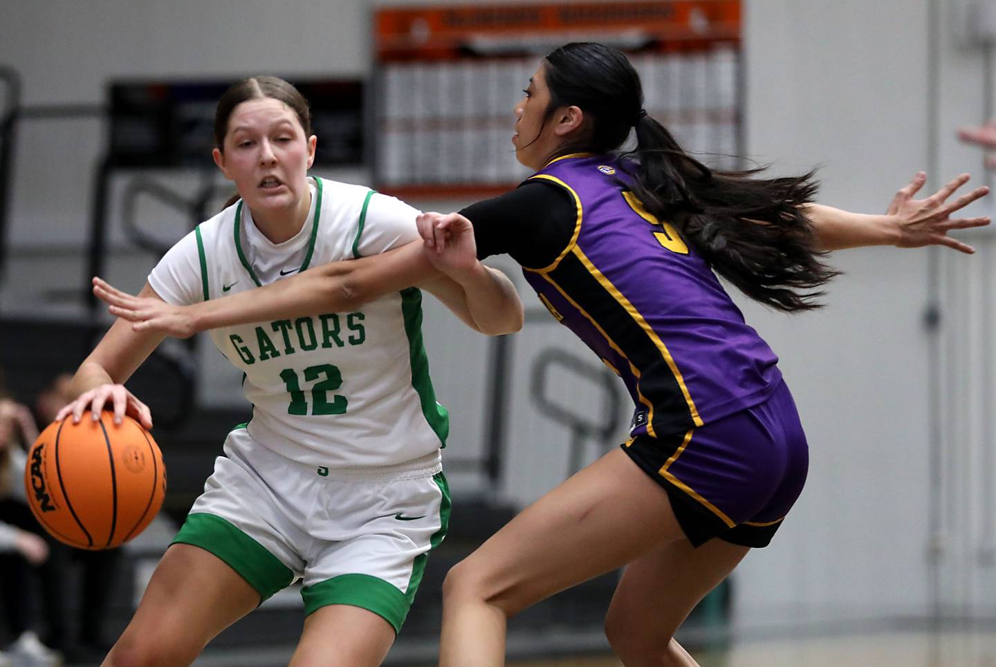 Crystal Lake South's Gaby Dzik is fouled by Wauconda's Alessandra Rodriguez as she drives to the basket during the Northern Illinois Holiday Classic Championship girl basketball game on Thursday, Dec. 18, 2025, at McHenry High School.