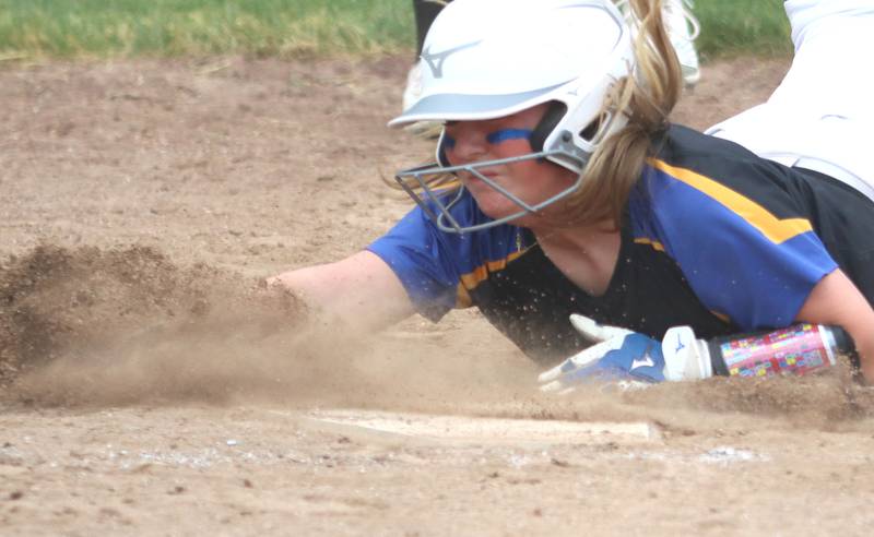 Aurora Central Catholic’s Meghan Buckley slides safely at home against Marengo in varsity girls softball IHSA Class 2A Regional Title Game action on Friday, May 22, 2026 at Raymond Benoy Field on the campus of Marian Central High School in Woodstock.