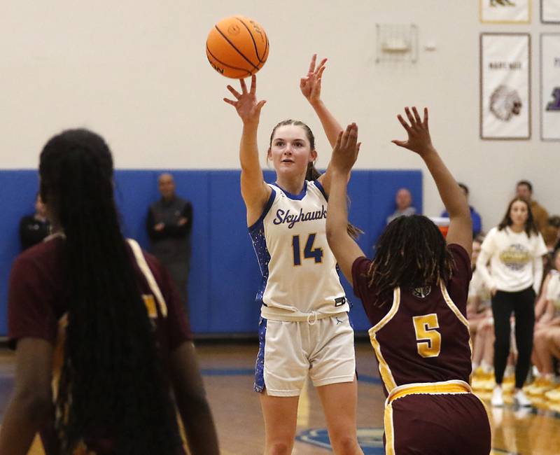 Johnsburg's Summer Toussaint shoots the ball over Chicago Marshall's Amira Amadji during a IHSA Class 2A Johnsburg Sectional girls basketball semifinal game on Tuesday, February, 24, 2026, at Johnsburg High School.