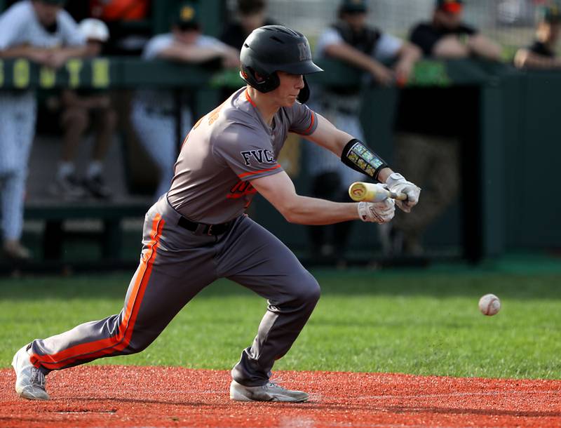 McHenry's Garet Lobbins lays down a bunt during a Fox Valley Conference baseball game against Crystal Lake South on Monday, April 13, 2026, at Crystal Lake South High School.