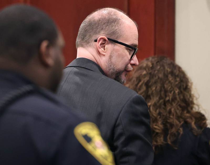 Jonathan D. Hurst takes one last look back at his family members Thursday, Jan. 30, 2025, at the DeKalb County Courthouse, after being found guilty of the 2016 murders of elderly mother and son Patricia Wilson and Robert Wilson in Sycamore.