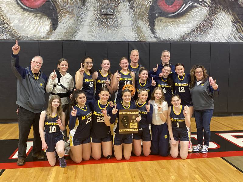 Yorkville Christian's girls basketball team celebrates after beating Serena for the program's first regional championship.