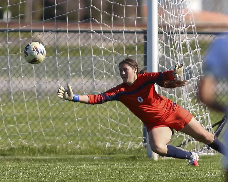 Kyla Baier (0) dives on a block attempt during a soccer match between Plainfield North at Oswego on Monday, May 11, 2026 in Oswego.