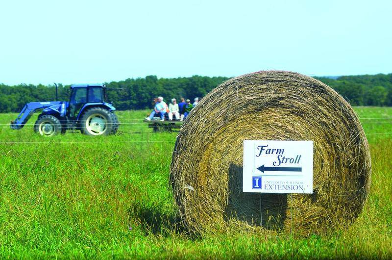 A hayrack of visitors is pulled across one of the grazing fields at Dietrich Ranch during the first Farm Stroll in Ogle County. This year's event is scheduled for Oct. 15.