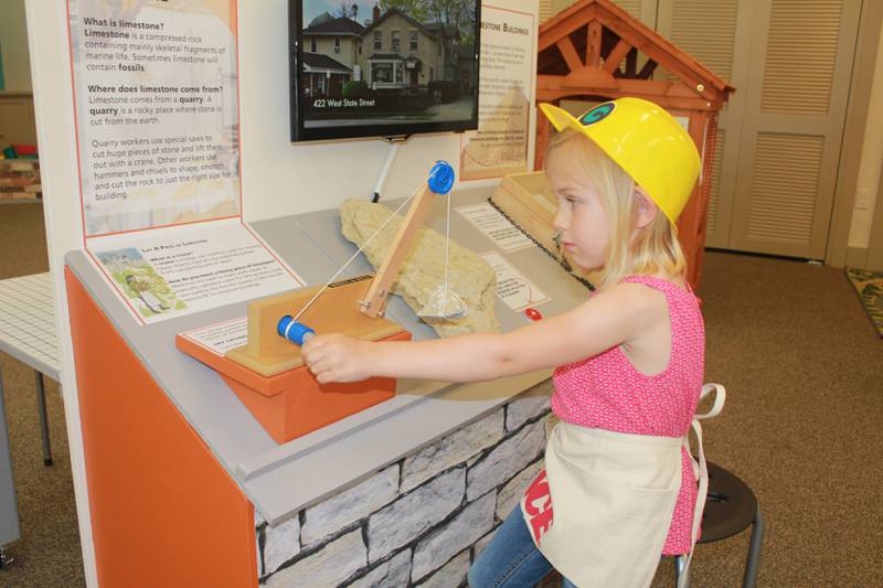 A young visitor explores the Geneva History Museum’s “Building Geneva” children’s exhibit in 2017. Exhibit reopens in June.