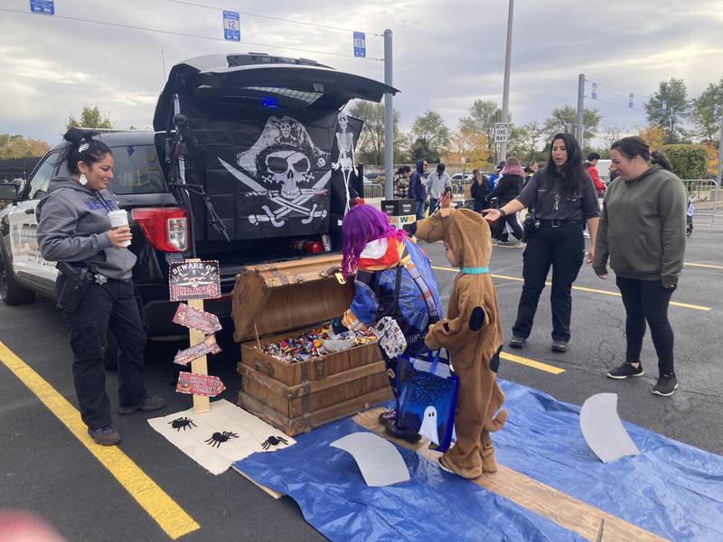 Kids trick-or-treat at a pirate themed trunk created by the Joliet Police Explorers.
Saturday, Oct. 25, 2025.