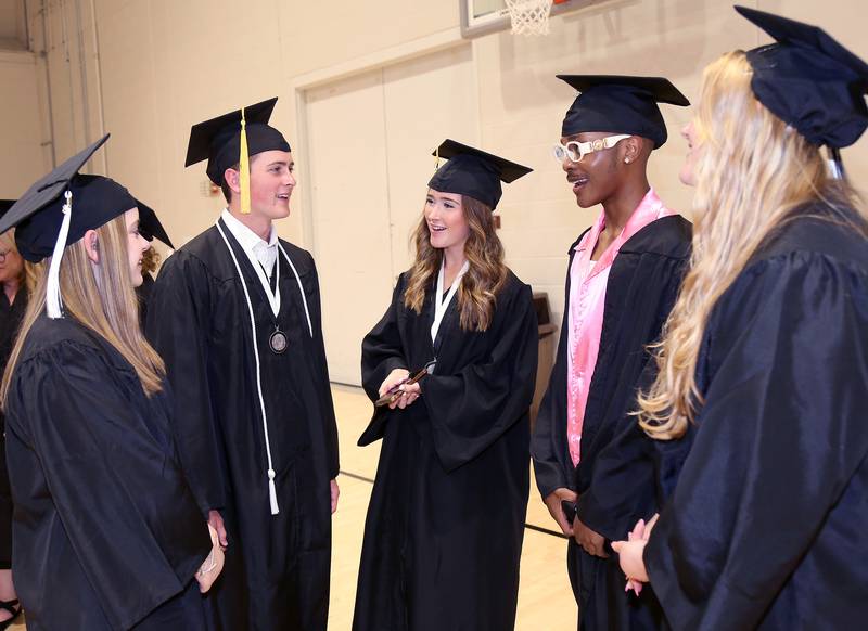 Hope Williams, Ethan Yost, Lindsay Yost, Javon Woods and Gabby Ziemba chat before the Kaneland High School Class of 2023 Graduation Ceremony on Sunday, May 21, 2023 in DeKalb.