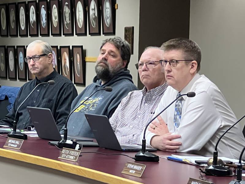Members of Sycamore's City Council, as well as the city manager, look on during a City Council meeting on Dec. 5, 2022.

From left to right: First Ward Ald. Alan Bauer, Second Ward Ald. Pete Paulsen, Second Ward Ald. Chuck Stowe, Sycamore City Manager Michael Hall.
