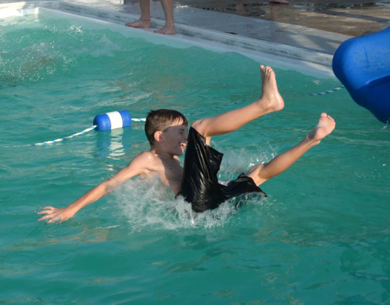 Asher Wakenight, 7, of Sterling, makes a splash in the Polo Pool on Thursday, Aug. 24, 2023. The pool was open from 5-8 p.m. during the recent hot spell to give people a place to cool down.