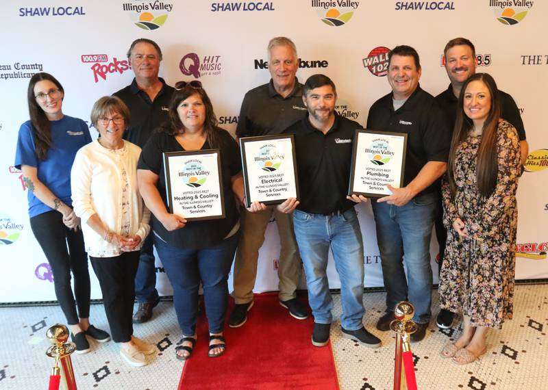 The staff of Town and Country Services pose for a photo during the second annual Best of the Illinois Valley event on Thursday at the Auditorium Ballroom in La Salle.