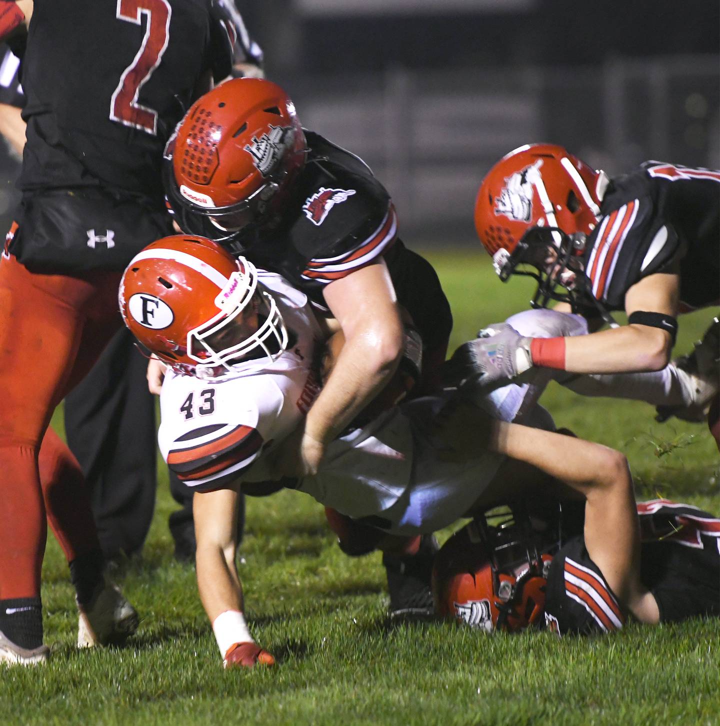 Fulton's Cole Schipper tackles Forreston's Kaleb Sanders.