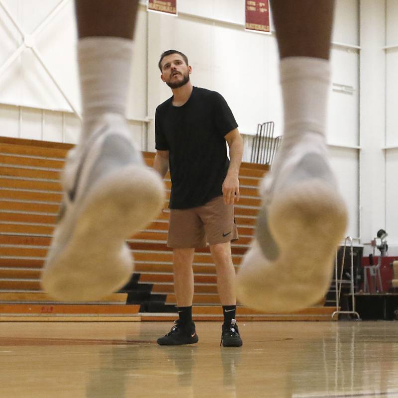 Zac Boster, the assistant men's basketball coach at Triton College in River Grove, and a Huntley graduate, watches Shaq Harrison’s jump shot as he works with him on his basketball skills Thursday morning, Sept. 29, 2022. Boster has made a name for himself in the basketball world, teaching skills to high-level college and pro players.