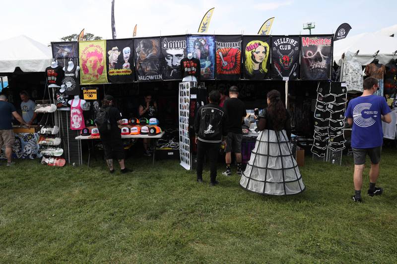 Festival goers check out one of the dozens of vendors on day one of Riot Fest. Friday, Sept. 17, 2022, in Chicago.