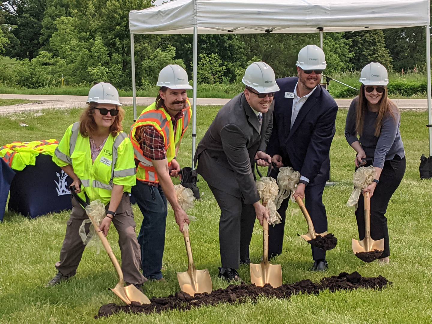 From left to right, Oswego Village Trustee Jennifer Hughes, Oswego Assistant Public Works Director / Village Engineer Phil Tartaglia, Oswego Village President Ryan Kauffman, Oswego Village Administrator Dan Di Santo and Oswego Assistant Village Administrator  Jean Bueche on June 2 participate in a ground breaking ceremony for the Minkler Road Bridge replacement project.
