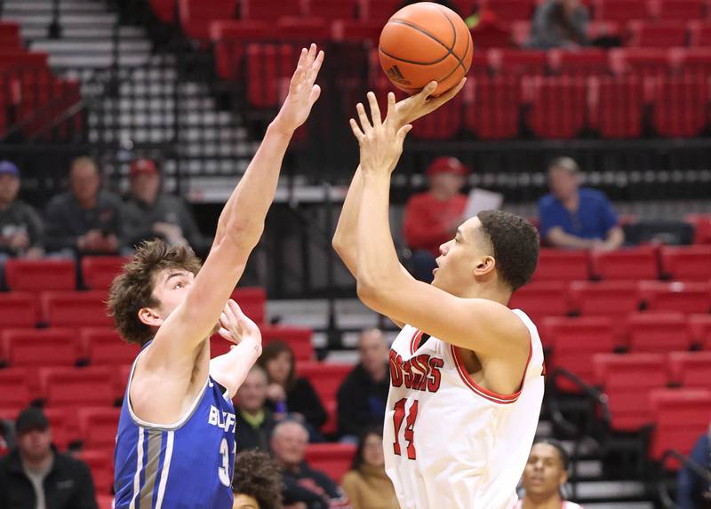 Northern Illinois Huskies forward Yanic Konan Niederhauser shoots over Buffalo Bulls center Isaac Jack Tuesday, Feb. 28, 2023, during their conference matchup at the Convocation Center at NIU.