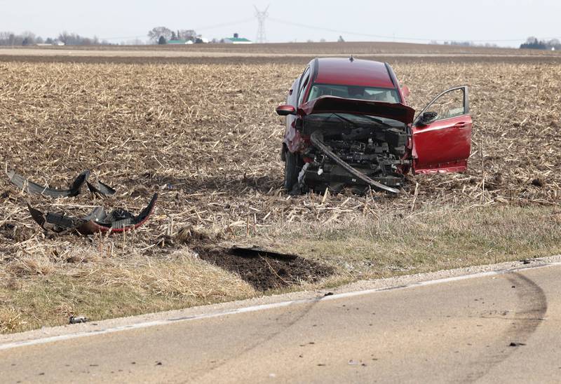 Skid marks and debris show the path a badly damaged vehicle took into a cornfield on the east side of Somonauk Road south of McGirr Road Wednesday, March 25, 2026, after a two vehicle crash near Hinckley.