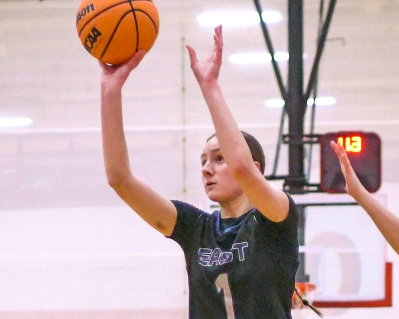 Oswego East's Aubrey Lamberti (1) makes a basket during the game on Thursday Dec. 18, 2025, while traveling to take on Yorkville High School.