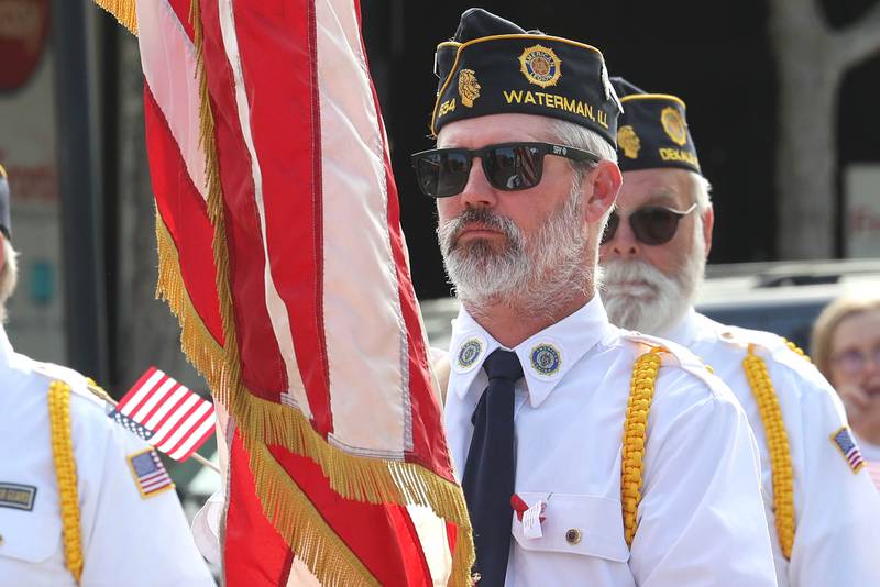 A member of the Waterman American Legion Post 654, along with members of the DeKalb Post 66 march Monday, May 29, 2023, in the DeKalb Memorial Day parade.