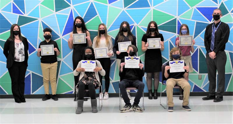 William B. Orenic Assistant Principal Lauren Scanlan and Troy Middle School Assistant Principal Matthew Stortz present the December 2021 Troy Community School District 30-C Students of the Month.