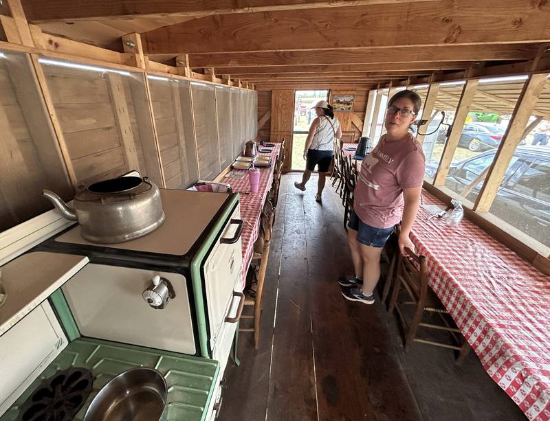 Kathy Smith of Erie was very busy on Saturday, Sept. 21, 2024, making corn bread in the "Cook Shack"  at the Bos Bros. Historical Farm Old Fashioned Fall Harvest south of Erie on Springhill Road. Smith. Displays of antique ag equipment and hands-on demonstrations of past agricultural chores were highlighted at the event. Corn was picked from a field with vintage machinery and was then shelled and ground into cornmeal where Smith made cornbread on a gas stove in the shack. The wooden shack, mounted on wheels, was pulled to threshing sites so workers could eat during threshing sessions without having to leave the field.