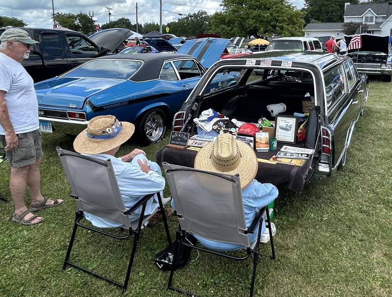 Bill and Joann Wagaman of Rockford chat with a visitor as they sit behind their 1965 Oldsmobile Vista Cruiser station wagon at the 34th Annual Hib Reber Memorial Car Show in Byron on Saturday, July 12, 2025.