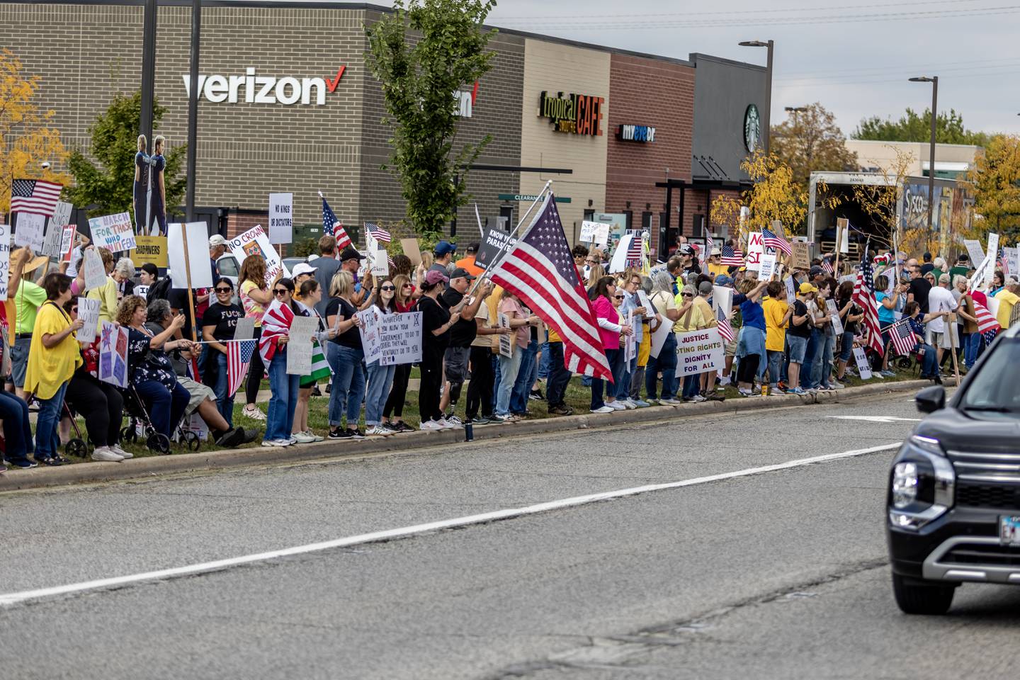 Protestors line Plainfield Road in Joliet during the No Kings Protest in Joliet on Oct. 18, 2025.