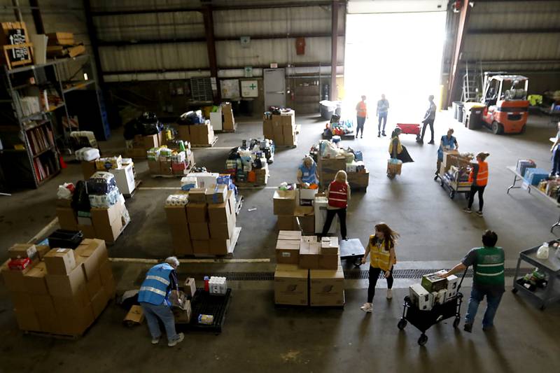 McHenry County Department of Health staff and volunteers from the McHenry County Medical Reserve Corp sort items during the Operation Dropbox Exercise on Tuesday , June 11, 2024, at the McHenry County Division of Transportation near Woodstock. The training exercise simulates the process of unloading and distributing medical counter-measures during emergencies along with helping to sort and distribute the donated items to veterans and their families in the county.