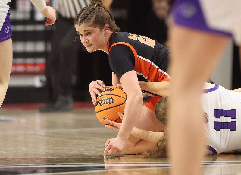 Byron's Aubrie Fuller falls on a loose ball with Breese Central's Taylor Trame during the Class 2A title game on Saturday, March 7, 2026 at CEFCU Arena in Normal.