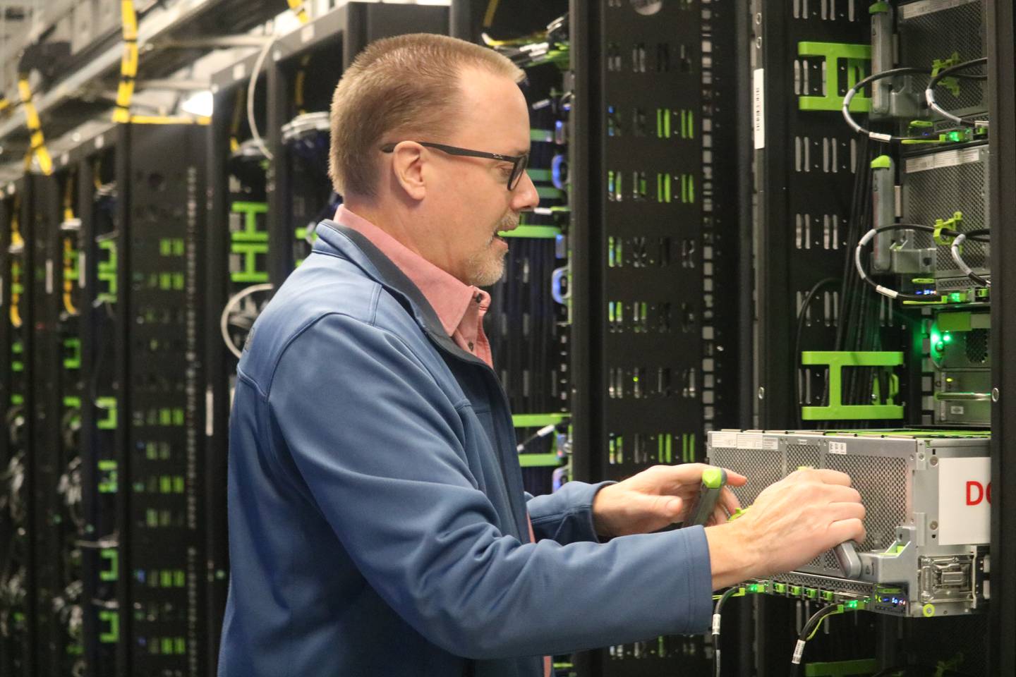 Michael Reffle, director of site operations north for Meta's DeKalb Data Center, gives a tour of the data storage spaces which are carefully temperature controlled at the campus, 2050 Metaverse Way, DeKalb on Wednesday, Nov. 29, 2023. The data center's servers are now operational. Once complete, the campus will house more than 2.3 million square feet across five buildings.