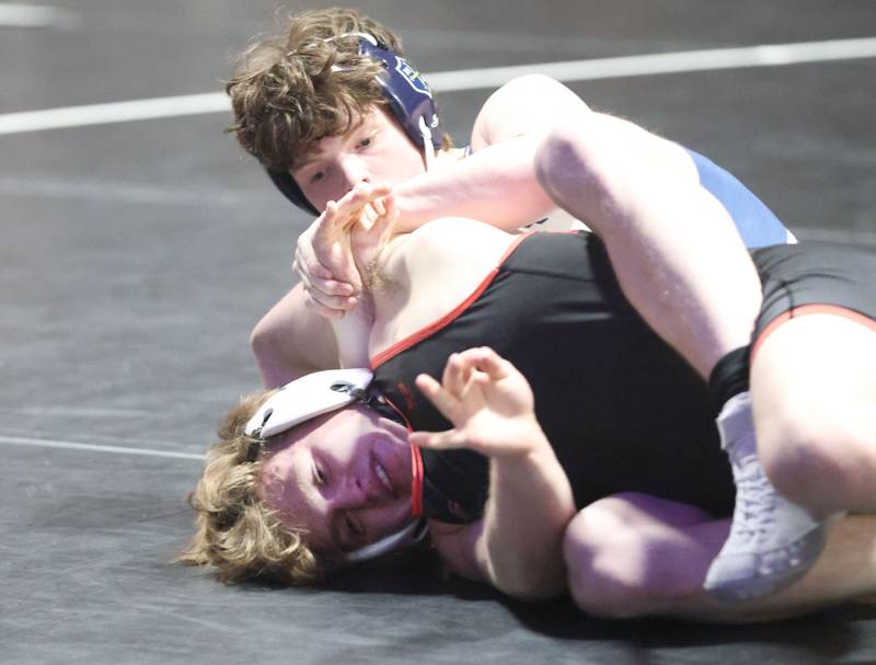 Marquette's Brysen Manley wrestles Bradley Bourbonnias's Joh Schafer on Wednesday, Jan. 14, 2026 in Bader Gymnasium at Marquette Academy.