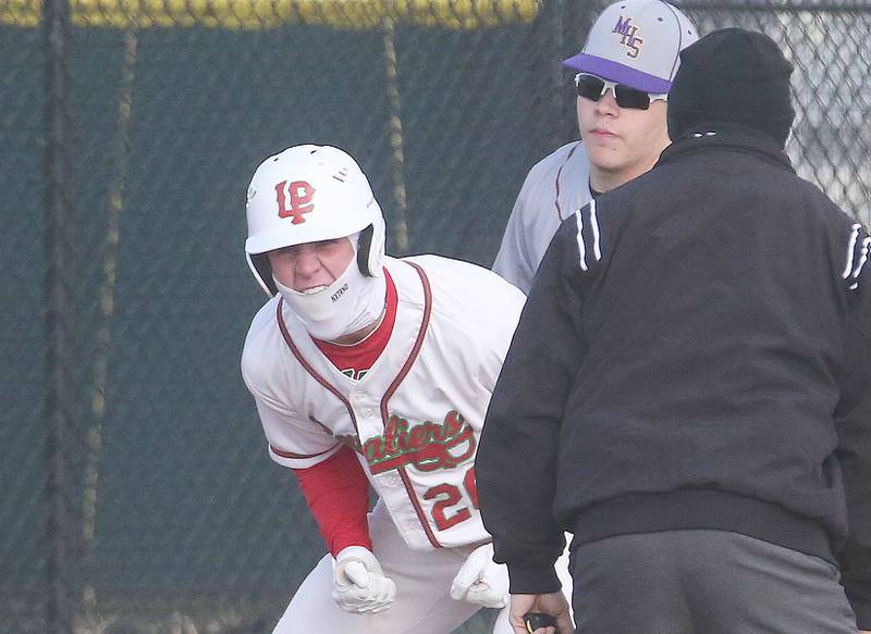 L-P's Griffin May reacts while standing on thried base after hitting a triple as Mendota third baseman Osacar Castaneda backs away from the bag on Thursday, April 3, 2025 at Huby Sarver Field inside the L-P Athletic Complex in La Salle.