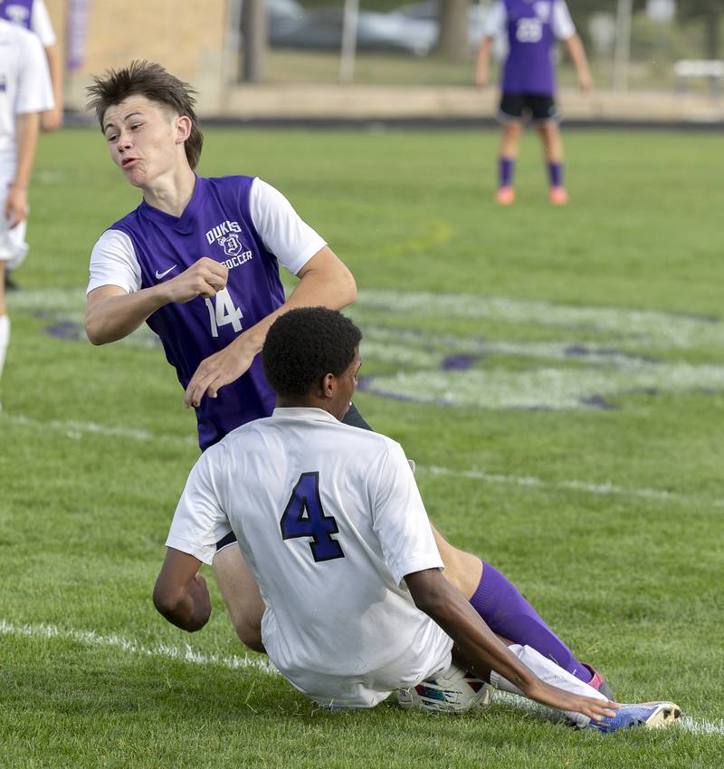 Dixon’s Landon Aldridge and Rockford Lutheran’s Kaiden Mason collide on a play for the ball Wednesday, Sept. 18, 2024.