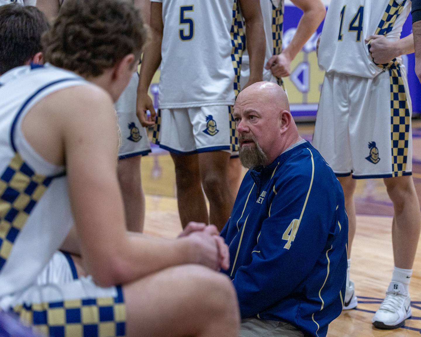 Marquette's Head Coach Todd Hopkins talks to team during timeout in the Class 1A Regional Boys Basketball Championship game against St. Bede on Friday, Feb. 27, 2026 at Serena High School.