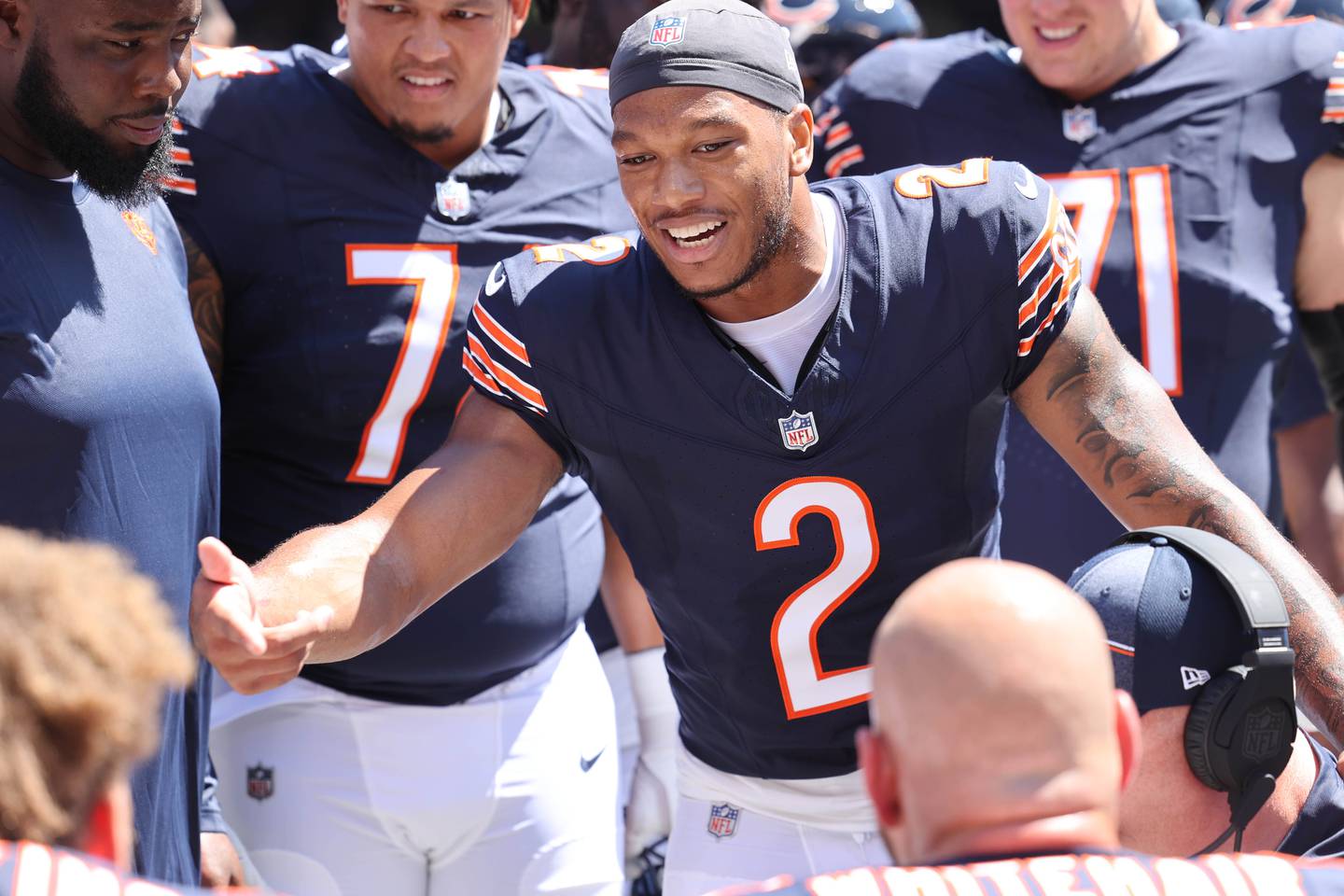 Chicago Bears wide receiver DJ Moore thanks the offensive linemen after his touchdown during their preseason game against the Tennessee Titans Saturday, Aug. 12, 2023, at Soldier Field in Chicago.