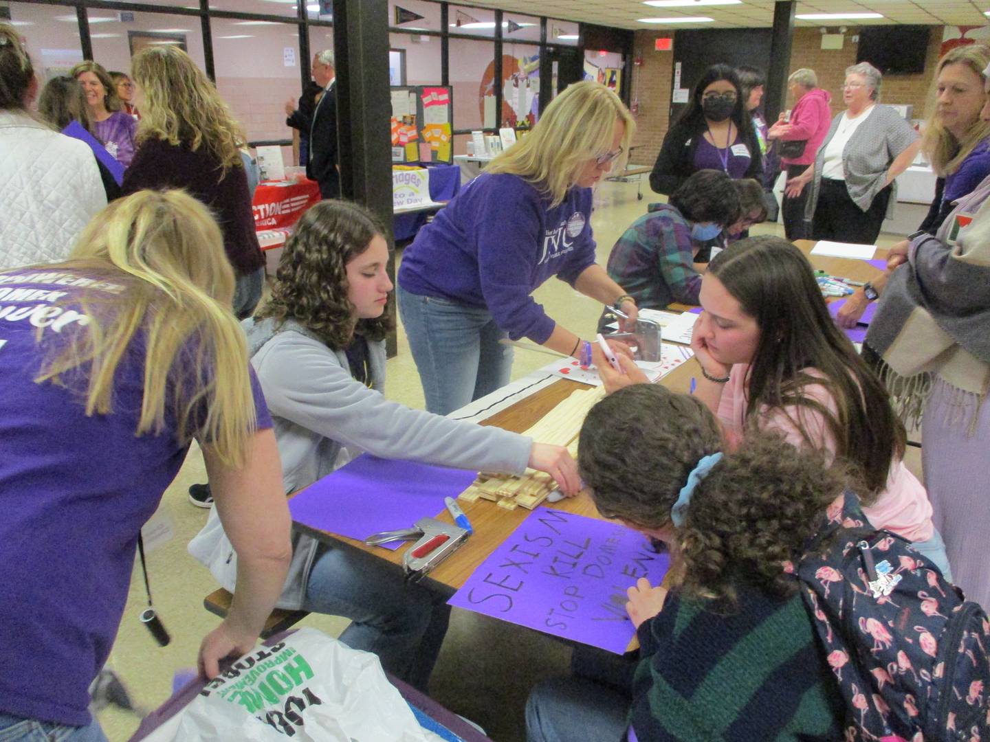 Joliet Junior Women's Club members and volunteers make signs at Hufford Junior High School in Joliet on Thursday for the Take Back the Night march. Oct. 20, 2022.