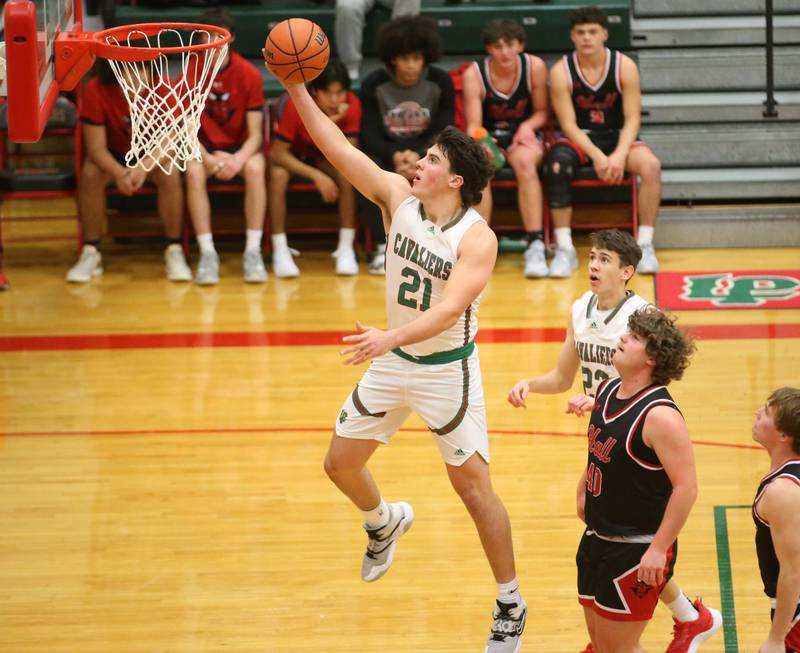L-P's Josh Senica sprints to the hoop to score on a layup over Hall's Payton Dye on Tuesday, Nov., 28, 2023 in AJ Sellett Gymnasium at L-P High School.