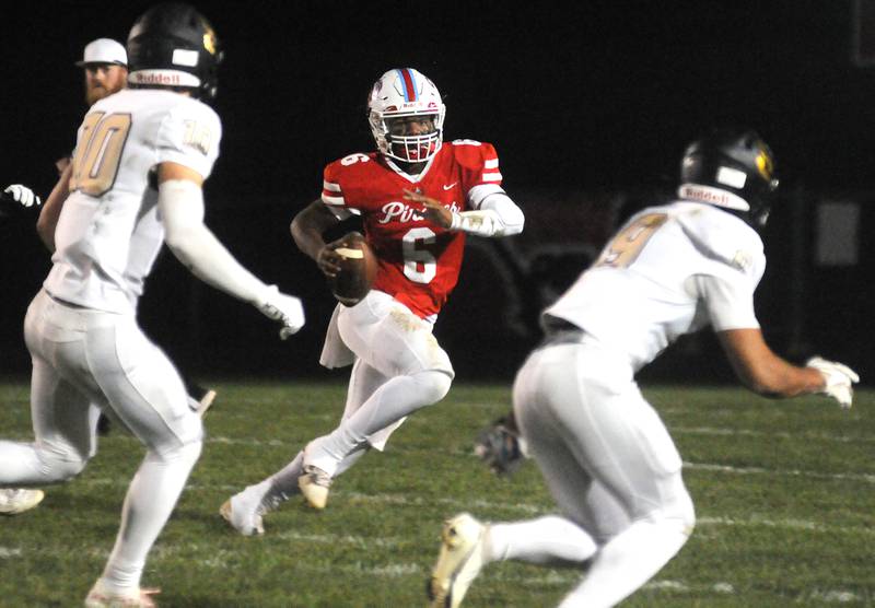 Ottawa senior quarterback Colby Mortenson looks for an open receiver while on the run in a game this past season against Sycamore. This fall, Mortenson also coached the offense for the fifth- and sixth-grade Eagles in the Ottawa Youth Football League.