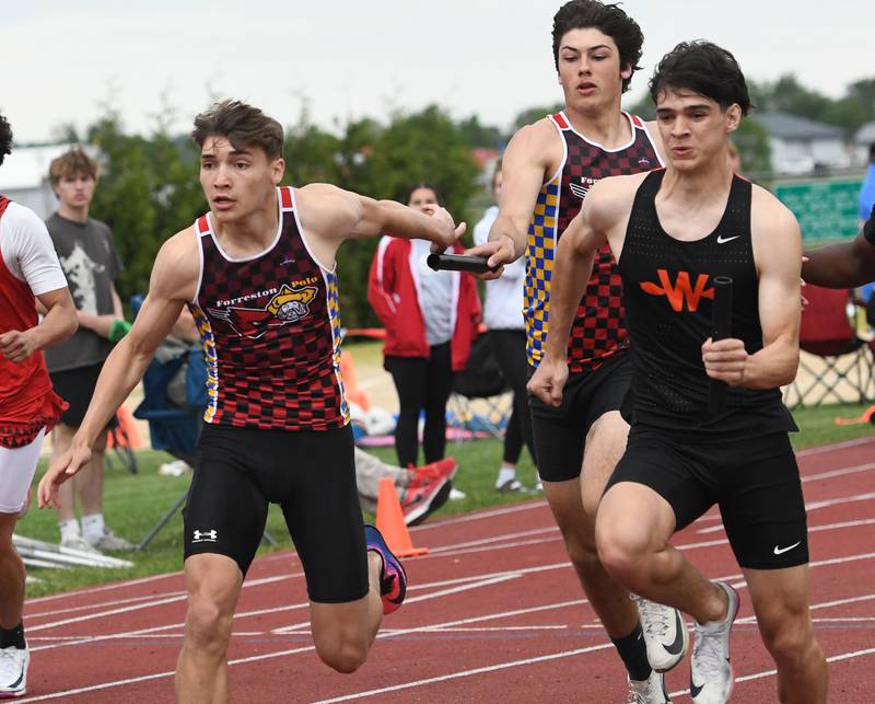 Forreston-Polo's Jonathan Milnes hands the baton to Mercer Mumford in the 4x100 relay at the 1A Oregon Sectional on Friday, May 22, 2026.