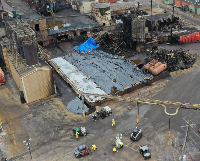 A hazmat team cleans up chemicals at Carus Chemical on Tuesday, Jan. 17, 2023 in La Salle.