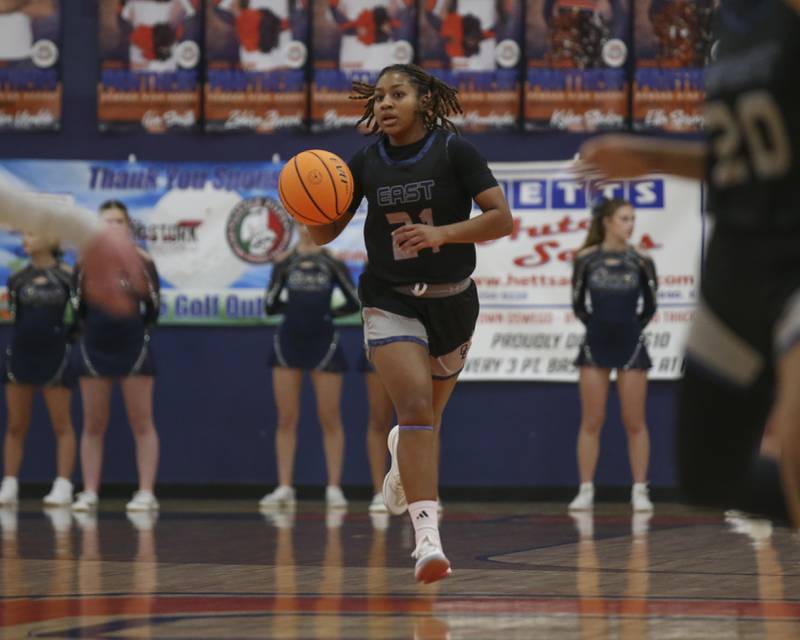 Oswego East's Desiree Merritt advances the ball during their basketball game between Oswego East at Oswego Friday, Jan 09, 2026 in Oswego.