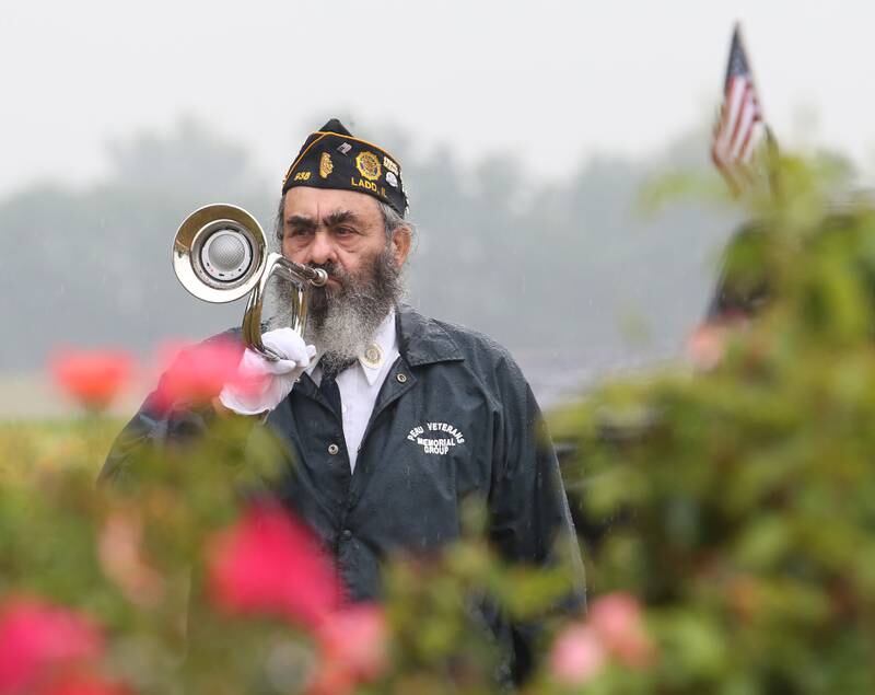 Andy Ruggerio, plays Taps during a memorial service remembering September 11, 2001 on Monday Sept. at Veterans Park in Ladd.