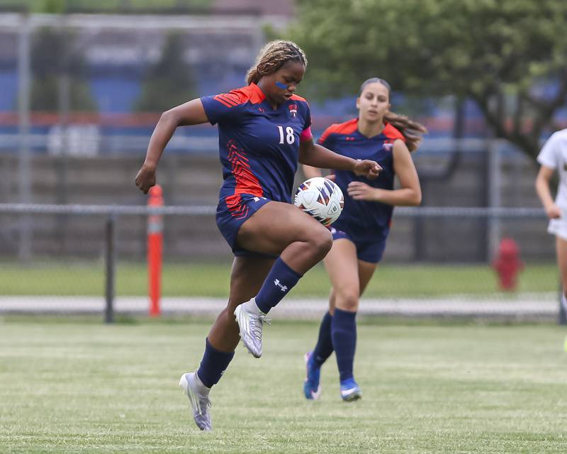 Oswego's Jordyn Washington (18) controls the ball during Class 3A regional final soccer match between Neuqua Valley at Oswego on Saturday, May 23, 2026 in Oswego.
