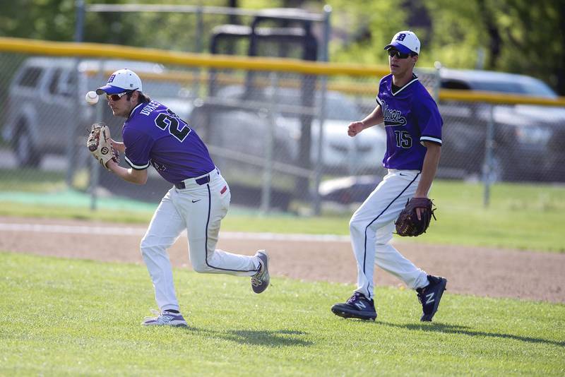 Dixon’s Ryan Pitzer has the ball slip out of his hand while looking to make a throw to first.