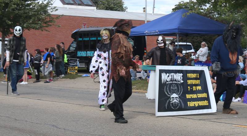 The Nightmare on Fairgounds Road team walks during the 54th annual Homestead Festival parade on Saturday, Sept. 6, 2025 in Princeton.